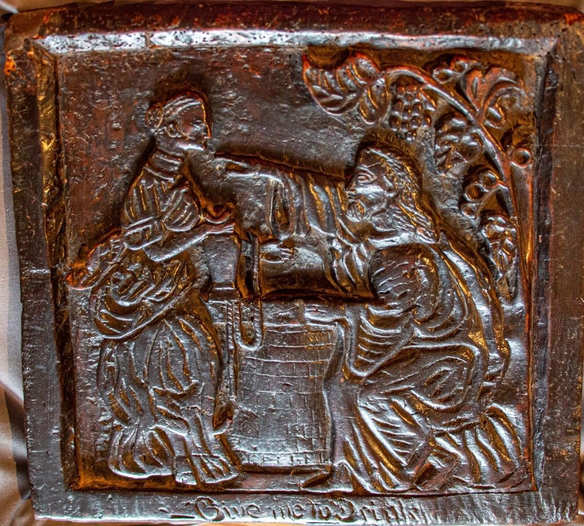 A rare C17th carved burr oak panel, English ‘Rebecca and Eliezer at the Well’