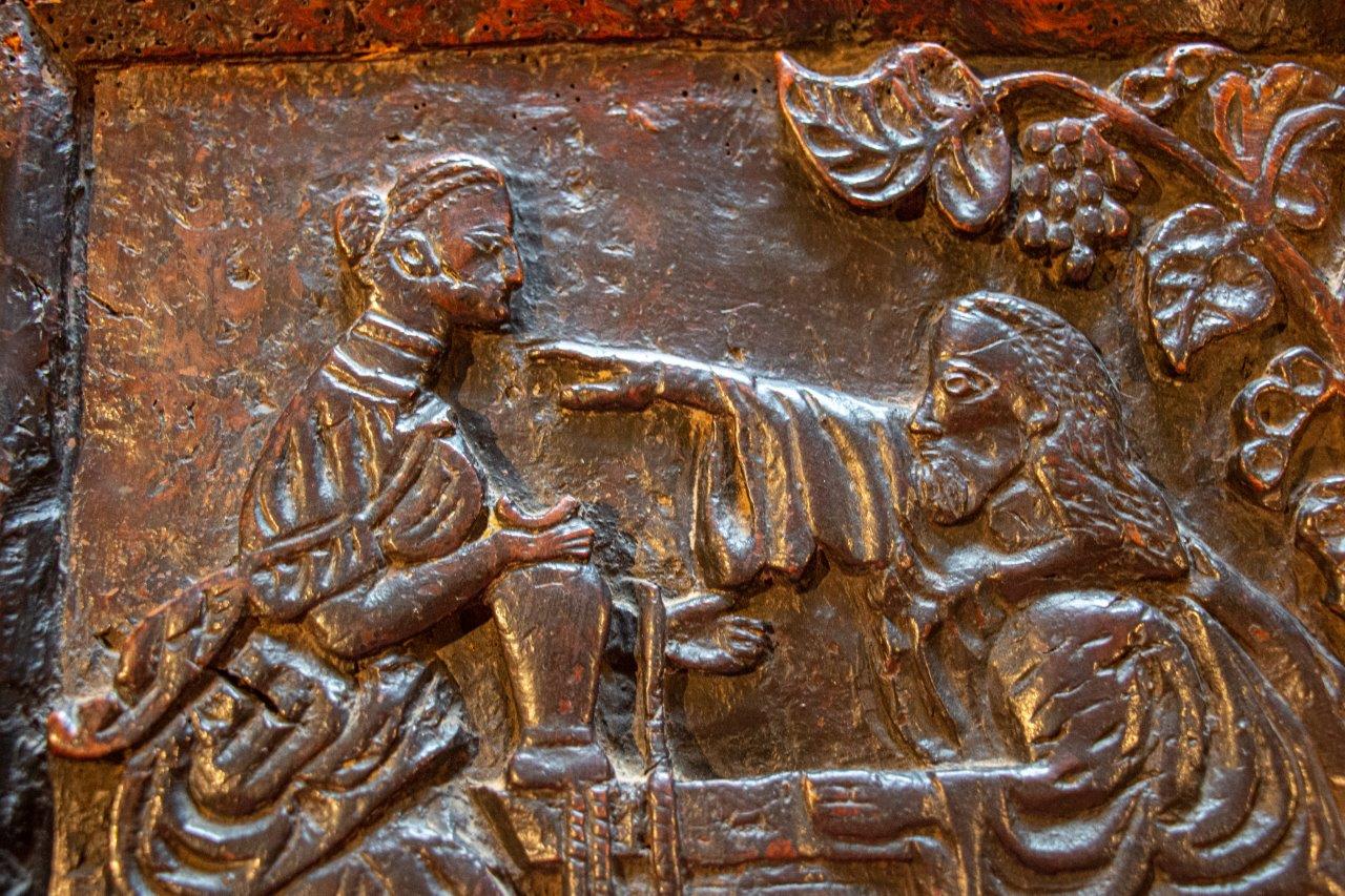 A rare C17th carved burr oak panel, English ‘Rebecca and Eliezer at the Well’